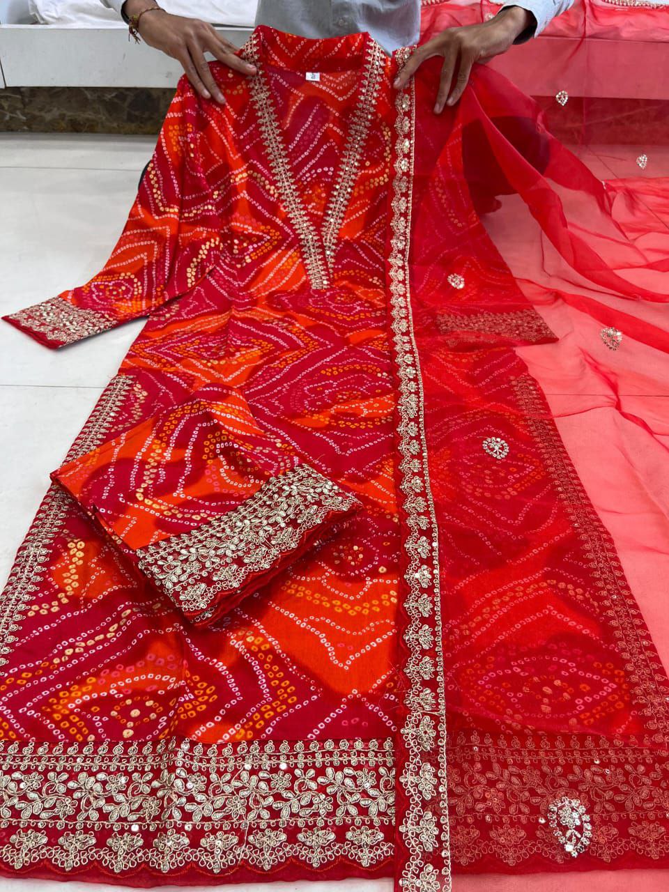 Stylish Red Bandhej Georgette Suit with Gold Lace Detailing